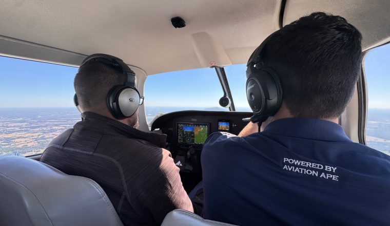 Two people wearing aviation headsets in the cockpit during a Right Rudder flight training session